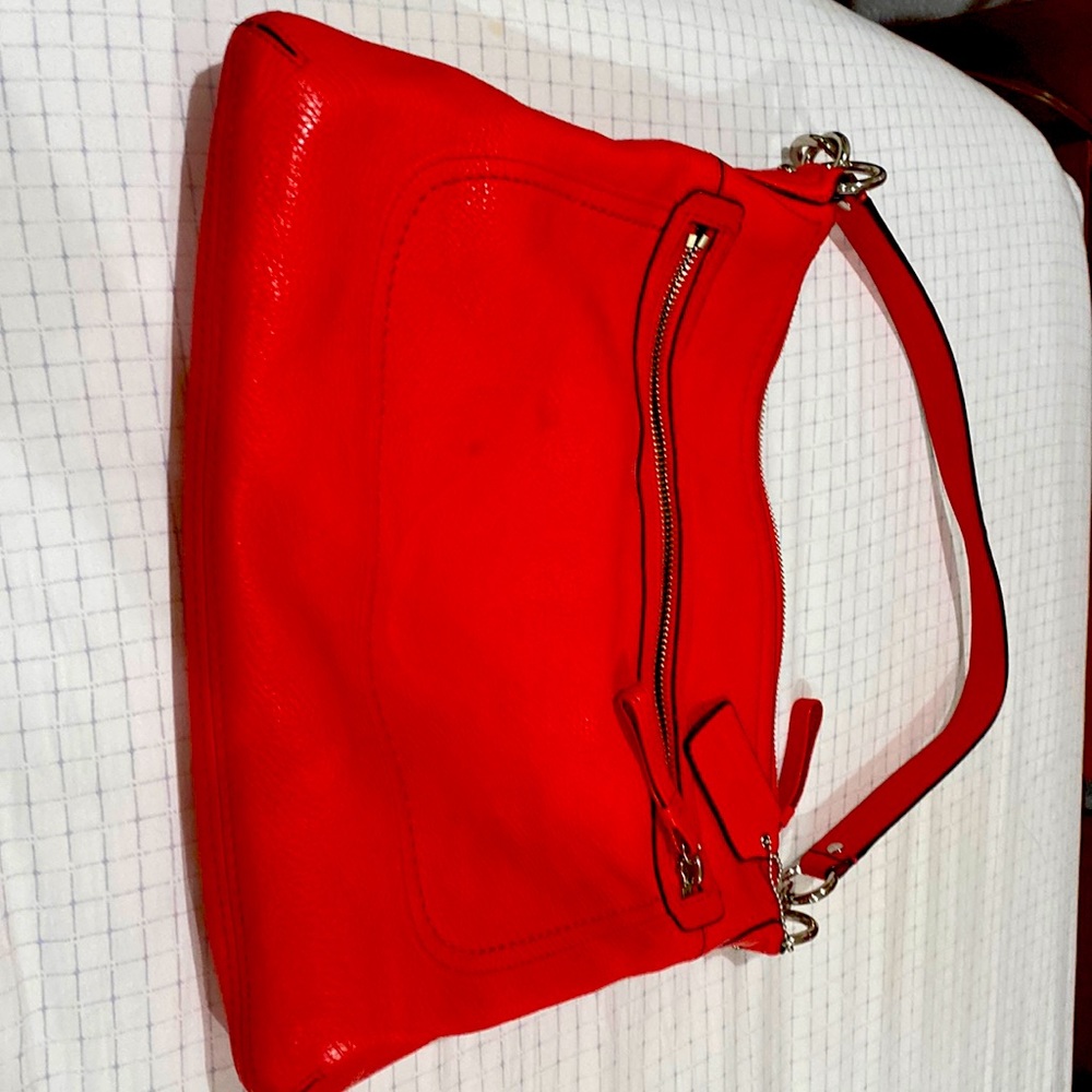 Beautiful reddish flesh mamey color,leather Coach purse!